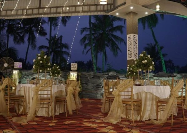 Evening outdoor wedding reception setup by catering services in Thrissur